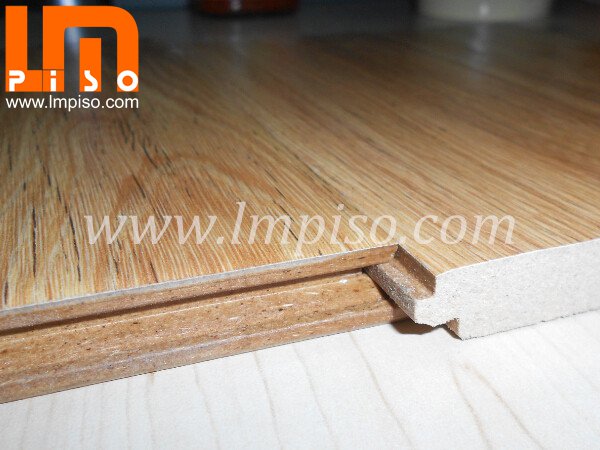 Glossy surface pressed v groove waxed water resistant laminat